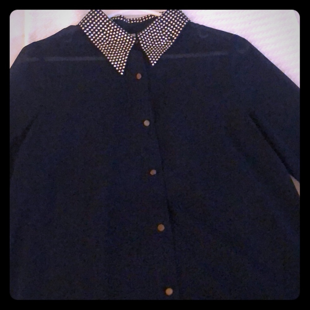 Long sleeve sheer blouse.